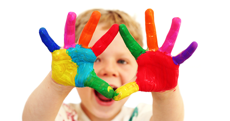 Happy child with painted hands